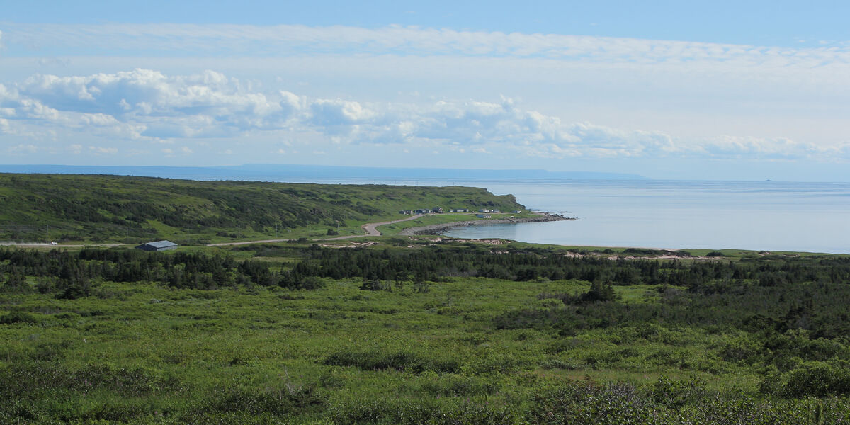 L'Anse Amour, Aug 2022. The lighthouse is hidden from view by the headland. At right the Kajaq W crosses the strait.
